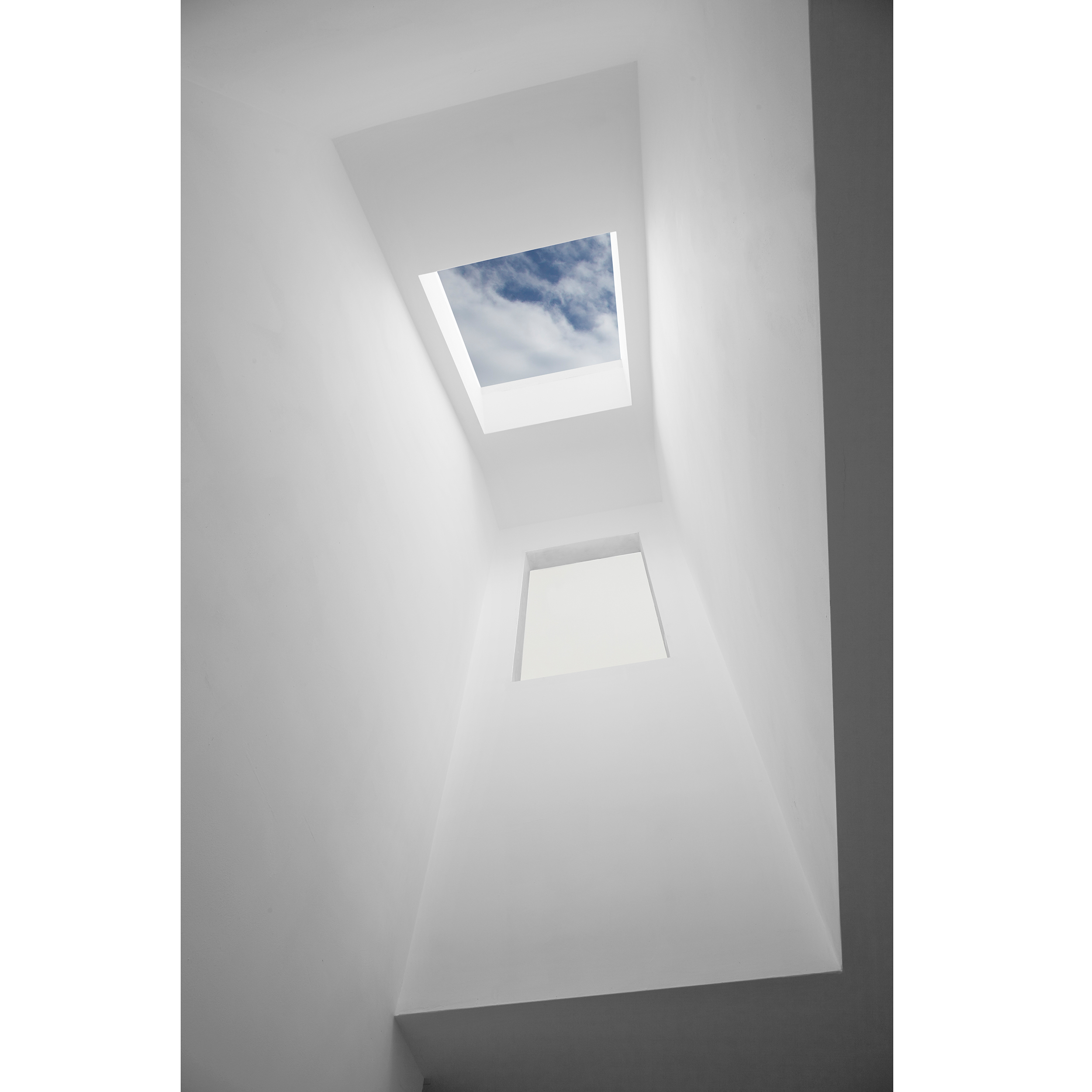 View of clouds through roof light