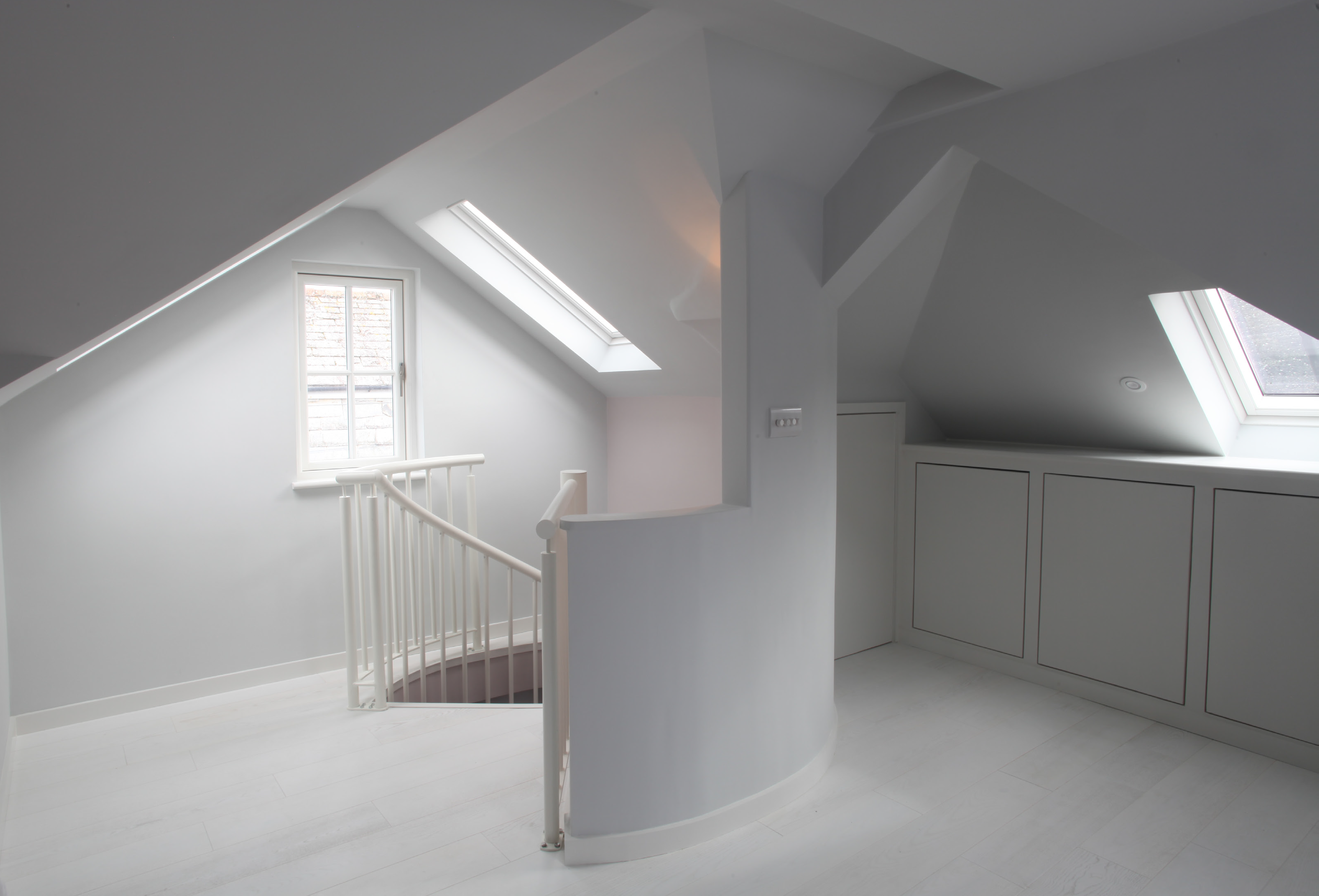 Photograph of top of spiral stair as it joins into the new rear dormer window.